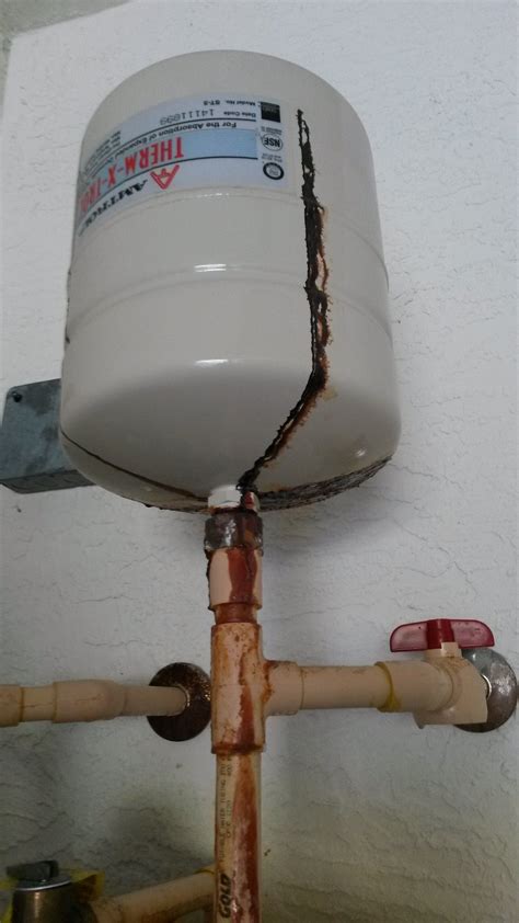 expansion tank leaking from bottom|How to Fix Common Water Heater Expansion Tank。